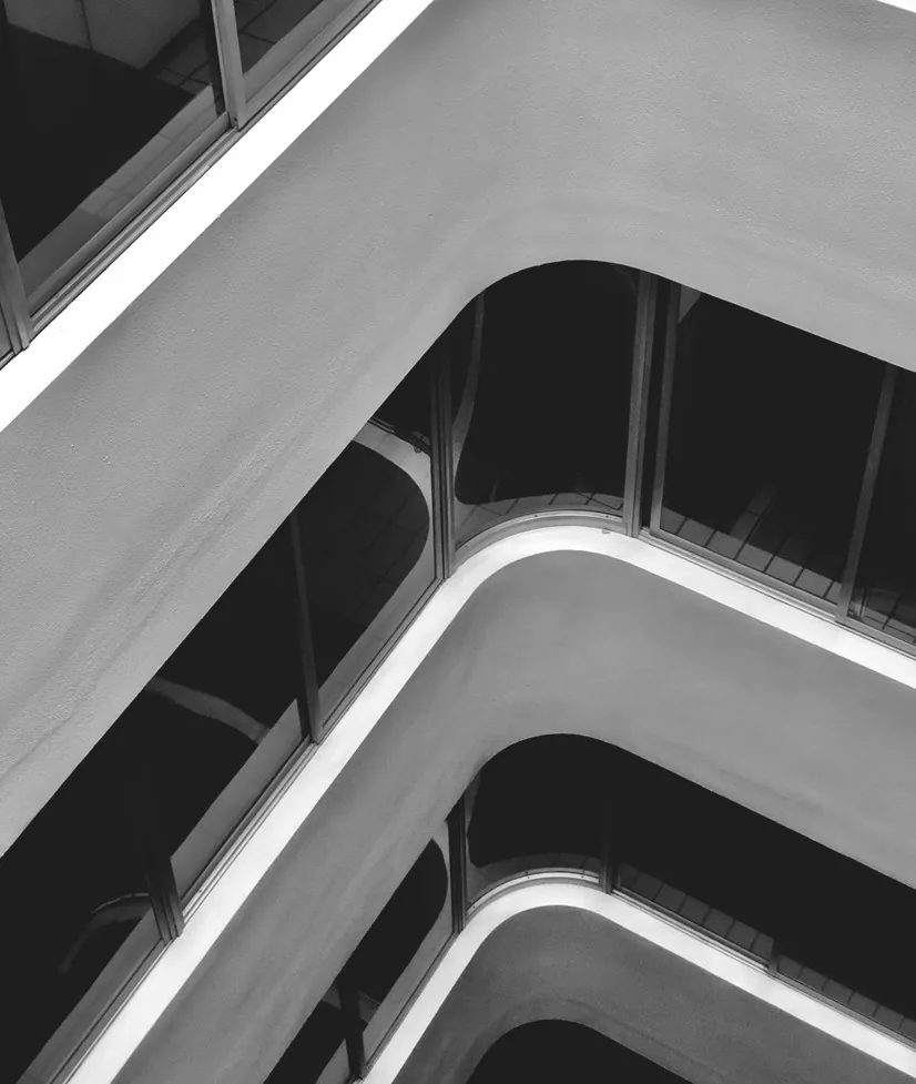 Curved concrete balcony soffits on a building facade